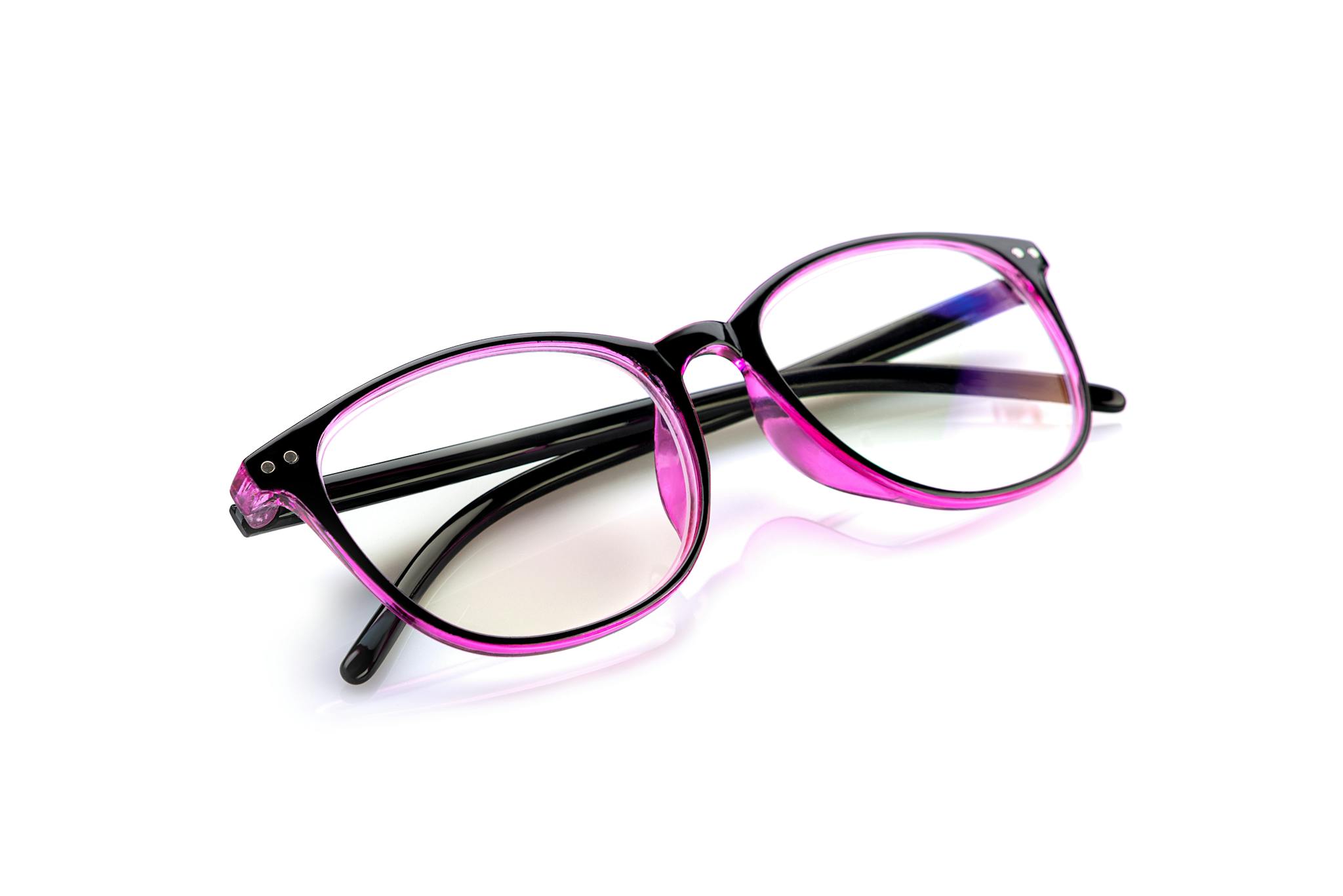 Close-up of trendy pink and black eyeglasses with clear lenses on a white backdrop, ideal for eyewear and fashion themes.