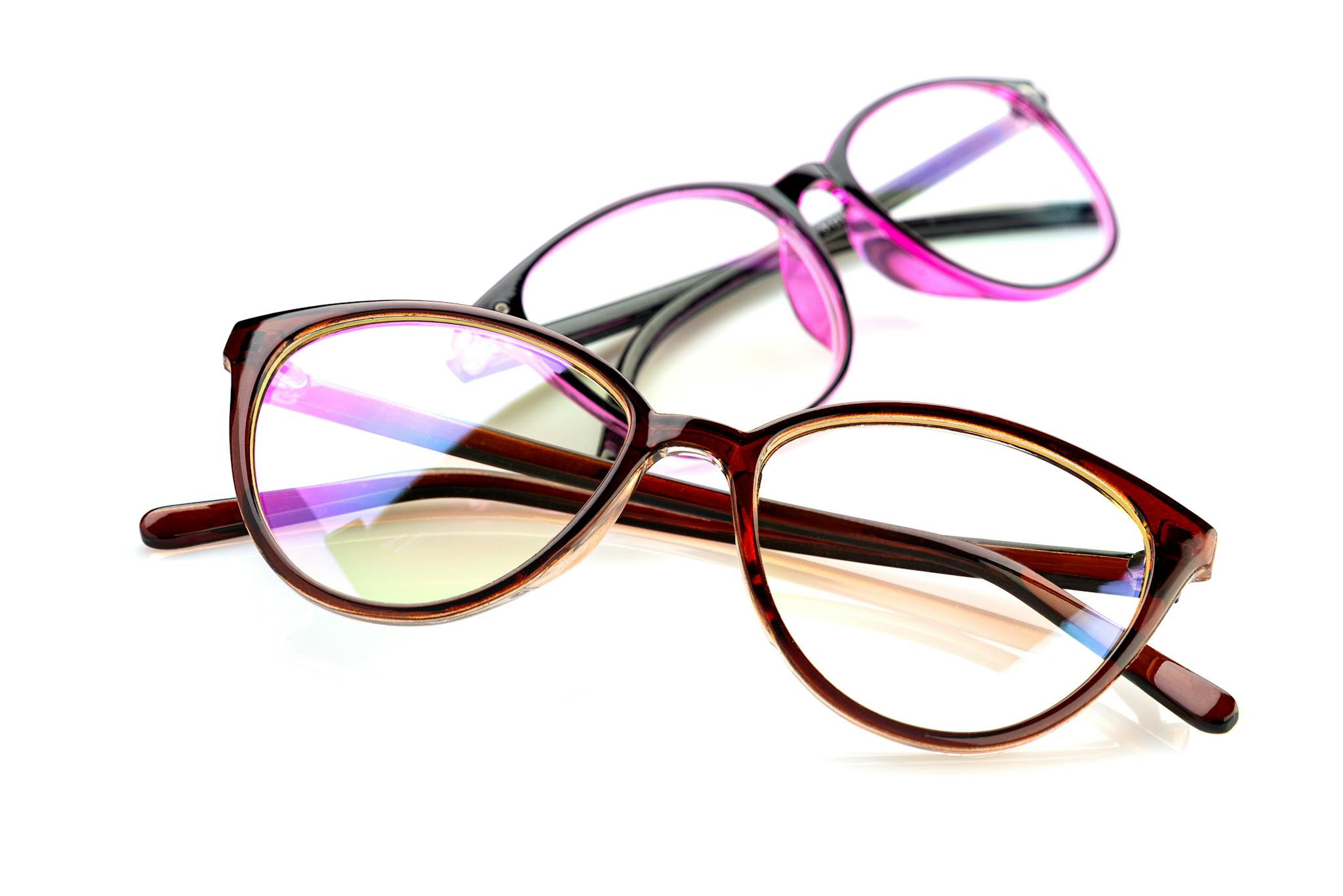 Close-up shot of fashionable brown and purple eyeglasses on a white background.